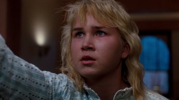 Movie still from “A Nightmare on Elm Street 3: Dream Warriors” (1987), directed by Chuck Russell – A woman with blonde hair and blue eyes looking up; Close Up shot, Low angle