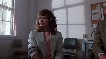 Movie still from “A Nightmare on Elm Street 3: Dream Warriors” (1987), directed by Chuck Russell – A woman sitting in front of a window in a room; Medium shot, Over the shoulder angle