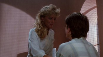 Movie still from “A Nightmare on Elm Street 3: Dream Warriors” (1987), directed by Chuck Russell – A woman talking to a young man in a room; Medium shot, Over the shoulder angle