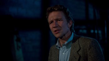 Movie still from “A Nightmare on Elm Street 3: Dream Warriors” (1987), directed by Chuck Russell – A man in a jacket and a blue dress shirt; Close Up shot, Over the shoulder angle