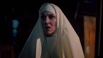 Movie still from “A Nightmare on Elm Street 3: Dream Warriors” (1987), directed by Chuck Russell – A woman in a nun's outfit is looking at the camera; Close Up shot, Low angle