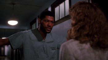 Movie still from “A Nightmare on Elm Street 3: Dream Warriors” (1987), directed by Chuck Russell – A man and a woman are talking in a room; Medium shot, Low angle