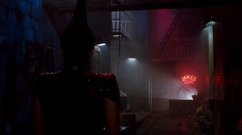 Movie still from “A Nightmare on Elm Street 3: Dream Warriors” (1987), directed by Chuck Russell – A woman in a black dress standing next to a fire hydrant; Wide shot, Over the shoulder angle