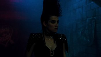 Movie still from “A Nightmare on Elm Street 3: Dream Warriors” (1987), directed by Chuck Russell – A woman in a black dress with a spiked mohawk; Close Up shot, Low angle