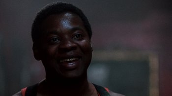 Movie still from “A Nightmare on Elm Street 3: Dream Warriors” (1987), directed by Chuck Russell – A person smiling for the camera; Close Up shot, Low angle