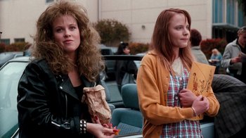 Movie still from “A Nightmare on Elm Street 4: The Dream Master” (1988), directed by Renny Harlin – Two women standing next to each other in a parking lot; Medium shot, Over the shoulder angle