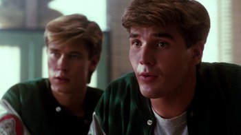 Movie still from “A Nightmare on Elm Street 4: The Dream Master” (1988), directed by Renny Harlin – Two young men looking into a mirror in a room; Close Up shot, Over the shoulder angle