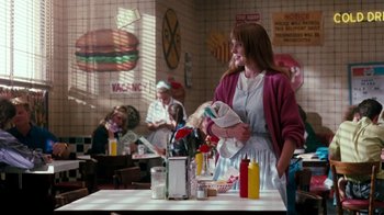 Movie still from “A Nightmare on Elm Street 4: The Dream Master” (1988), directed by Renny Harlin – A woman standing at a table in a restaurant; Medium shot, Over the shoulder angle