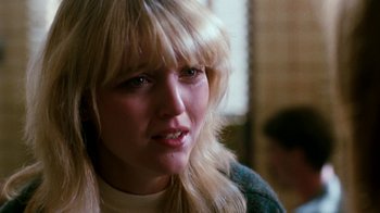 Movie still from “A Nightmare on Elm Street 4: The Dream Master” (1988), directed by Renny Harlin – A person with long blonde hair; Close Up shot, Over the shoulder angle