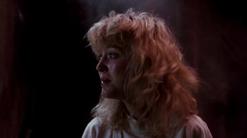 Movie still from “A Nightmare on Elm Street 4: The Dream Master” (1988), directed by Renny Harlin – A woman with long blonde hair looking to her left; Close Up shot, Low angle