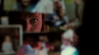 Movie still from “A Nightmare on Elm Street 4: The Dream Master” (1988), directed by Renny Harlin – A woman is looking at the reflection of herself in a mirror; Extreme Close Up shot, Over the shoulder angle