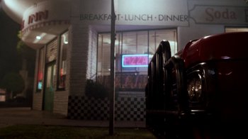 Movie still from “A Nightmare on Elm Street 4: The Dream Master” (1988), directed by Renny Harlin – A parking meter sitting in front of a restaurant; Wide shot, High angle