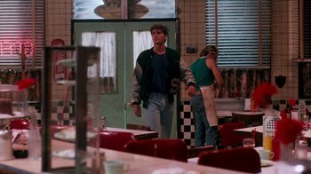 Movie still from “A Nightmare on Elm Street 4: The Dream Master” (1988), directed by Renny Harlin – A man and a woman standing in front of a diner; Medium shot, Over the shoulder angle