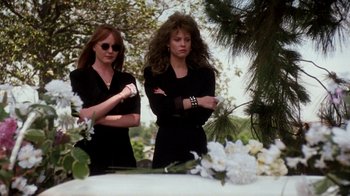 Movie still from “A Nightmare on Elm Street 4: The Dream Master” (1988), directed by Renny Harlin – A couple of women standing next to each other in front of a tree; Medium shot, Low angle