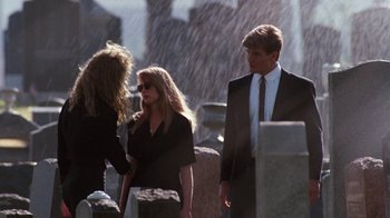 Movie still from “A Nightmare on Elm Street 4: The Dream Master” (1988), directed by Renny Harlin – A man and a woman standing next to each other in a cemetery; Medium shot, Over the shoulder angle
