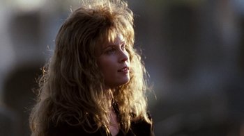 Movie still from “A Nightmare on Elm Street 4: The Dream Master” (1988), directed by Renny Harlin – A woman with long blonde hair looking to her left; Close Up shot, Over the shoulder angle