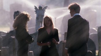 Movie still from “A Nightmare on Elm Street 4: The Dream Master” (1988), directed by Renny Harlin – Three people standing in front of a statue; Wide shot, Over the shoulder angle