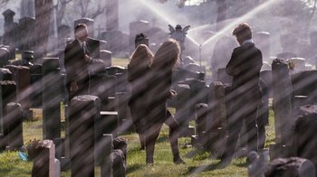 Movie still from “A Nightmare on Elm Street 4: The Dream Master” (1988), directed by Renny Harlin – A group of people standing in a cemetery; Wide shot, High angle