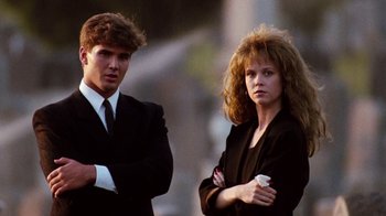 Movie still from “A Nightmare on Elm Street 4: The Dream Master” (1988), directed by Renny Harlin – A man and a woman standing next to each other; Medium shot, Low angle