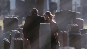 Movie still from “A Nightmare on Elm Street 4: The Dream Master” (1988), directed by Renny Harlin – A man and a woman walking through a cemetery; Wide shot, Over the shoulder angle