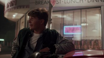 Movie still from “A Nightmare on Elm Street 4: The Dream Master” (1988), directed by Renny Harlin – A man sitting in front of a window in a restaurant; Medium shot, Over the shoulder angle