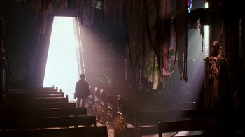 Movie still from “A Nightmare on Elm Street 4: The Dream Master” (1988), directed by Renny Harlin – A man standing in a room with a lot of benches; Wide shot, Low angle