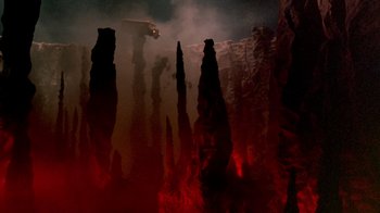 Movie still from “A Nightmare on Elm Street 2: Freddy's Revenge” (1985), directed by Jack Sholder – A truck is driving through a crater in the night sky; Extreme Wide shot, High angle