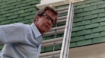 Movie still from “A Nightmare on Elm Street 2: Freddy's Revenge” (1985), directed by Jack Sholder – A person standing next to a ladder; Close Up shot, Low angle