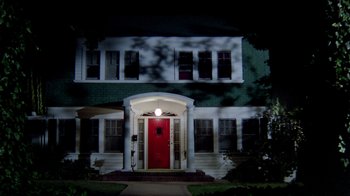 Movie still from “A Nightmare on Elm Street 2: Freddy's Revenge” (1985), directed by Jack Sholder – A red door in front of a green house; Extreme Wide shot, Low angle