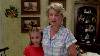 Movie still from “A Nightmare on Elm Street 2: Freddy's Revenge” (1985), directed by Jack Sholder – An older woman standing next to a young girl; Medium shot, Low angle