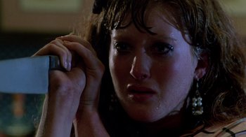 Movie still from “A Nightmare on Elm Street 2: Freddy's Revenge” (1985), directed by Jack Sholder – A person holding a cell phone; Close Up shot, High angle