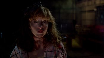 Movie still from “A Nightmare on Elm Street 2: Freddy's Revenge” (1985), directed by Jack Sholder – A person wearing a plaid shirt; Close Up shot, Low angle