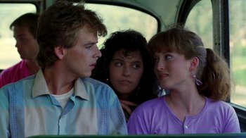 Movie still from “A Nightmare on Elm Street 2: Freddy's Revenge” (1985), directed by Jack Sholder – A group of people sitting in the back of a car; Medium shot, Over the shoulder angle