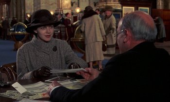 Movie still from “A Passage to India” (1984), directed by David Lean – A man and a woman sitting at a table in a restaurant; Medium shot, Over the shoulder angle