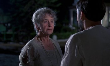 Movie still from “A Passage to India” (1984), directed by David Lean – An older woman talking to a younger man outside; Close Up shot, Over the shoulder angle