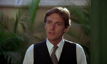 Movie still from “A Passage to India” (1984), directed by David Lean – A man wearing a vest and a polka dot neck tie; Close Up shot, Low angle