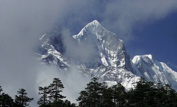 Movie still from “A Passage to India” (1984), directed by David Lean – A large mountain with snow on it's side; Extreme Wide shot, Low angle