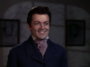 Movie still from “A Song to Remember” (1945), directed by Charles Vidor – A man wearing a suit and tie smiling for the camera; Close Up shot, High angle