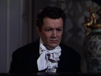 Movie still from “A Song to Remember” (1945), directed by Charles Vidor – A person wearing a suit and bow tie; Close Up shot, High angle
