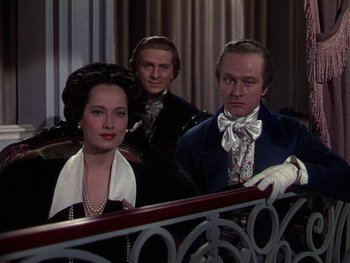 Movie still from “A Song to Remember” (1945), directed by Charles Vidor – A man and a woman standing next to each other in front of a railing; Medium shot, Over the shoulder angle