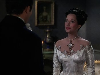 Movie still from “A Song to Remember” (1945), directed by Charles Vidor – A woman in a white dress standing in front of a man; Close Up shot, Over the shoulder angle