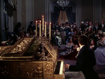 Movie still from “A Song to Remember” (1945), directed by Charles Vidor – A man sitting at a piano in front of a group of people; Wide shot, High angle