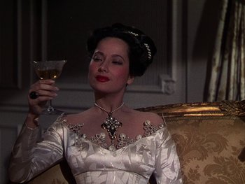 Movie still from “A Song to Remember” (1945), directed by Charles Vidor – A woman in a white dress holding a glass of wine; Close Up shot, High angle