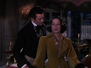 Movie still from “A Song to Remember” (1945), directed by Charles Vidor – A man and a woman standing next to each other; Medium shot, Over the shoulder angle