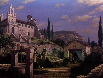Movie still from “A Song to Remember” (1945), directed by Charles Vidor – A painting of an old castle with a sky filled with dark clouds; Extreme Wide shot, Low angle