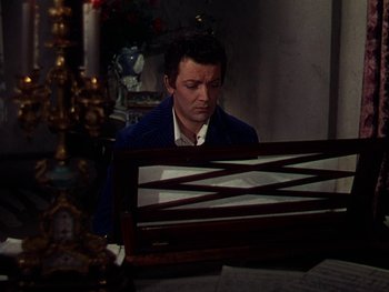 Movie still from “A Song to Remember” (1945), directed by Charles Vidor – A man sitting in front of an upright piano; Medium shot, High angle
