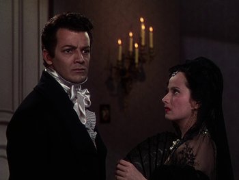 Movie still from “A Song to Remember” (1945), directed by Charles Vidor – A man and a woman standing next to each other in front of candles; Medium shot, Over the shoulder angle