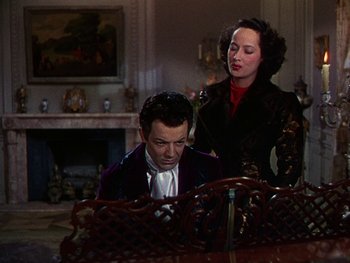 Movie still from “A Song to Remember” (1945), directed by Charles Vidor – A man and a woman are playing a piano together; Medium shot, High angle