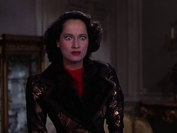 Movie still from “A Song to Remember” (1945), directed by Charles Vidor – A person wearing a suit and a red shirt; Close Up shot, High angle