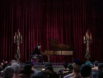 Movie still from “A Song to Remember” (1945), directed by Charles Vidor – A man sitting at a piano in front of an audience; Extreme Wide shot, High angle